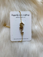Load image into Gallery viewer, White &amp; Gold Seahorse Adjustable Bracelet
